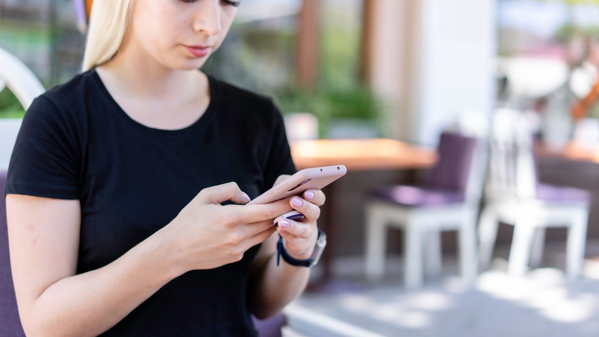 Woman browsing Instagram Reels on her phone