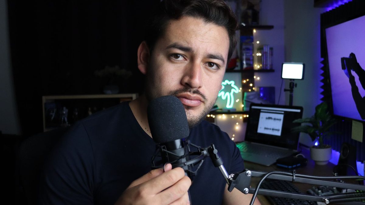 Creator filming a video at her desk studio