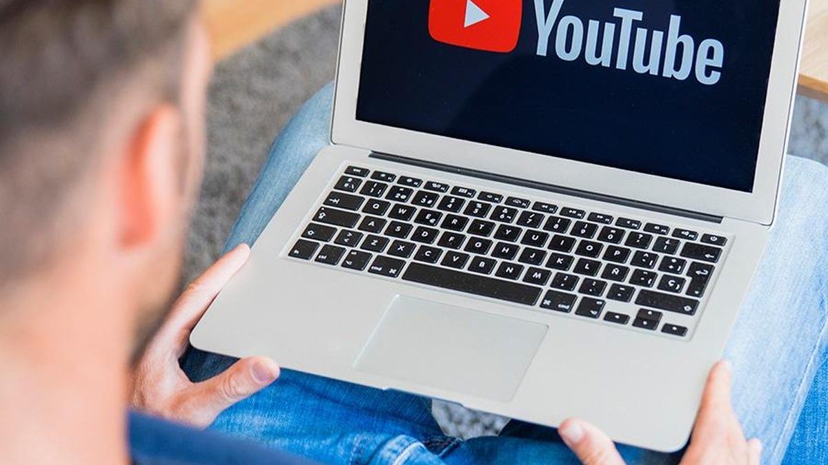 Person watching a YouTube video on a laptop