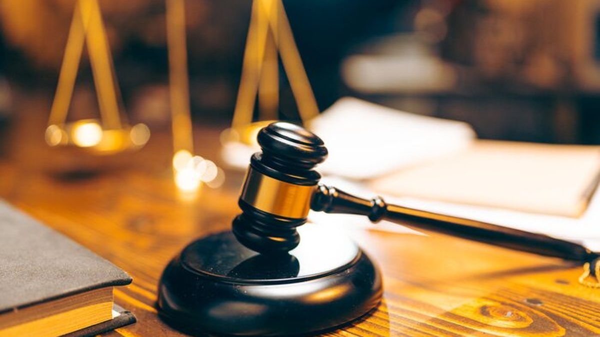 Gavel and scales of justice on a wooden desk