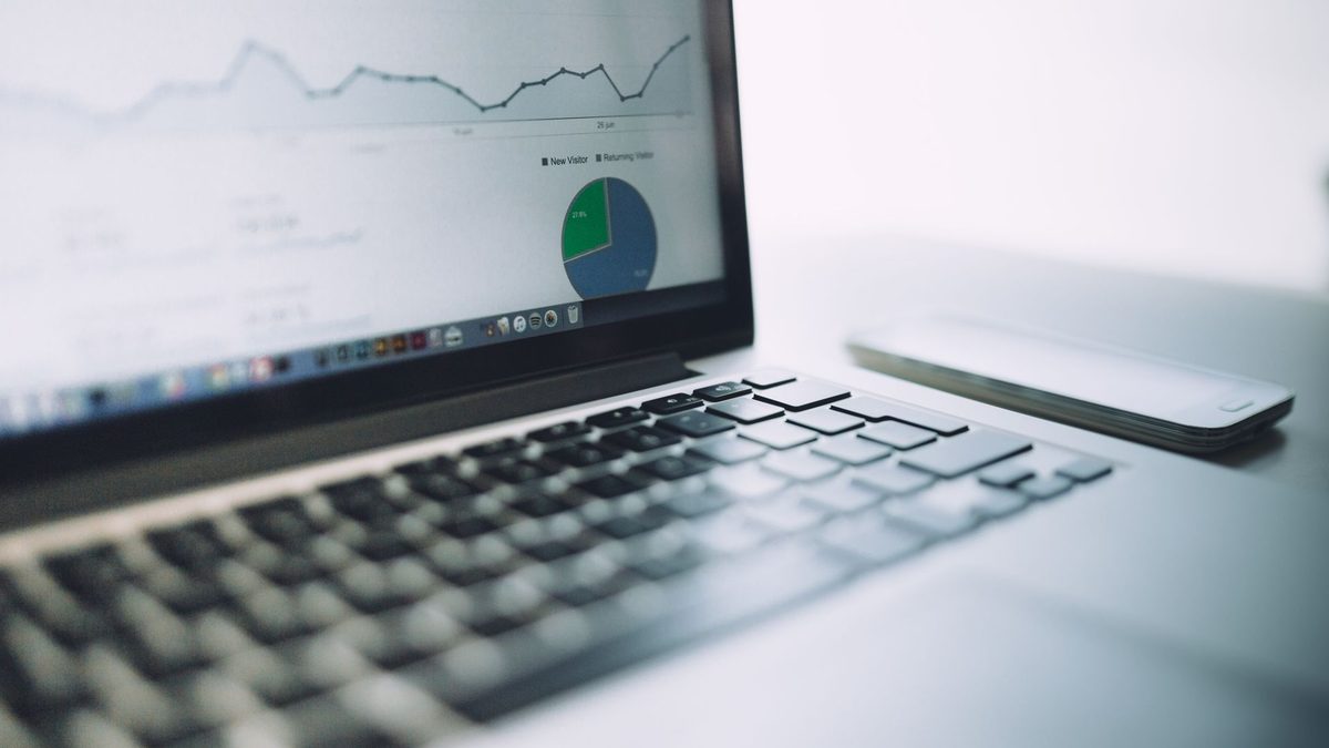 Laptop showing an analytics dashboard with graphs