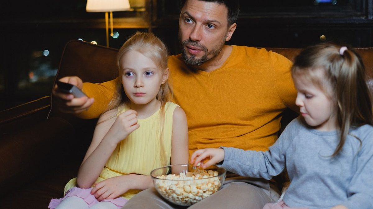 Couple watching a movie on a living-room TV
